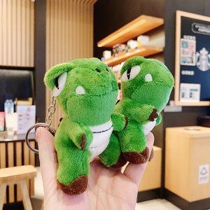 Brand new unused Tyrannosaurus Rex doll pendant